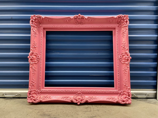 Antique rococo gilt wood and composite gallery frame with ornate detail, airbrushed bubble gum pink.