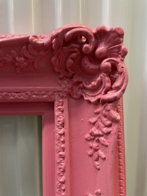 Antique rococo gilt wood and composite gallery frame with ornate detail, airbrushed bubble gum pink.